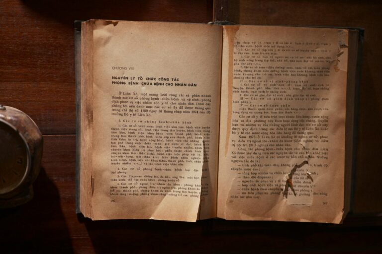 An open old book with yellowed pages